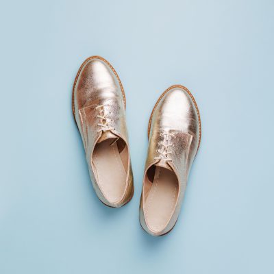 Fashion female  shoes on blue background.  Flat lay, top view.